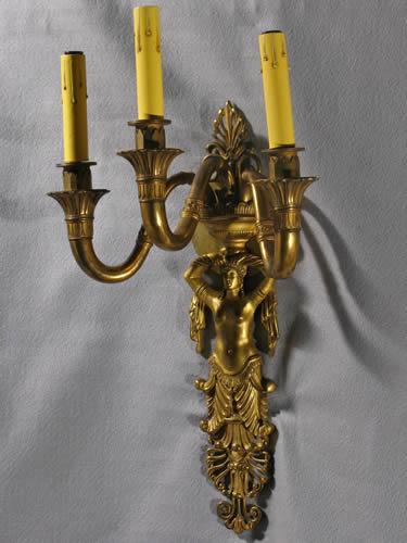Pair of Cast Bronze Egyptian Revival Figural Sconces